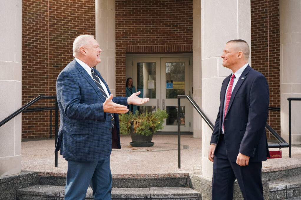 John Brooker, right, visits with Kirk Warner, for whom the award is named. (Photo courtesy of UNC School of Law.)