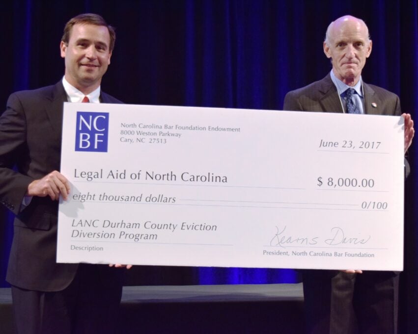 George Hausen, right, accepts gift from NCBA President Kearns Davis at 2017 Annual Meeting.