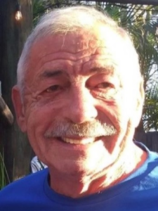 Jody, a man with grey hair and a mustache, is pictured wearing a blue shirt.